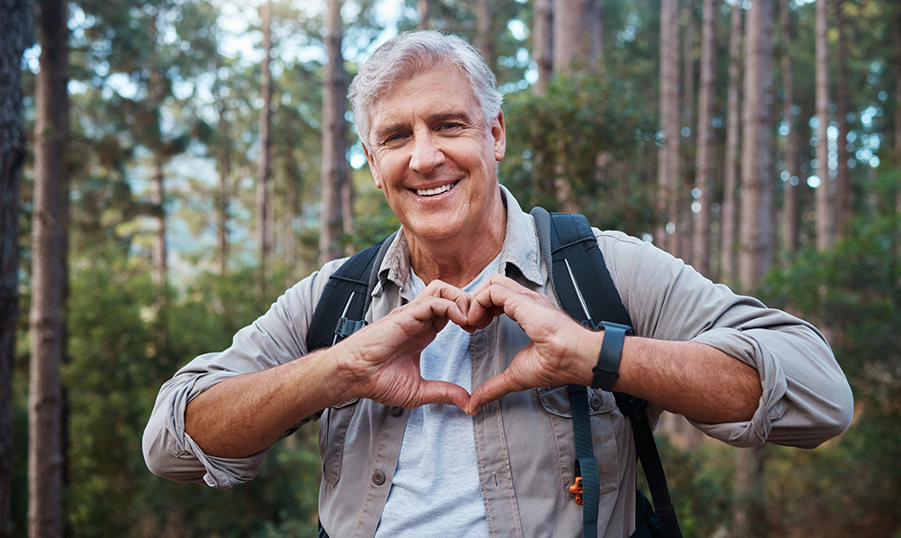 portrait,,heart,and,senior,man,in,forest,hiking,,fitness,and