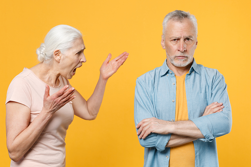 angry,irritated,elderly,gray haired,couple,60s,woman,man,in,casual