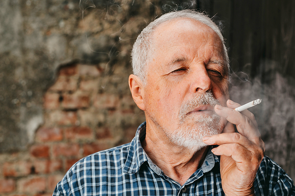an,old,senior,man,smoking,cigarette,outside,,smoke,addiction,,bad