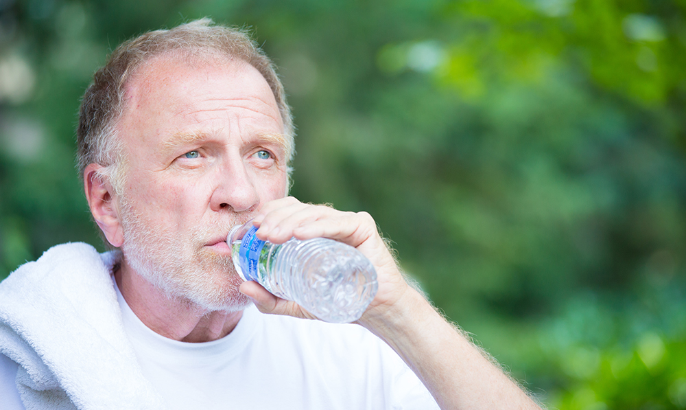 closeup,portrait,,thirsty,senior,mature,man,drinking,water,outside,,isolated