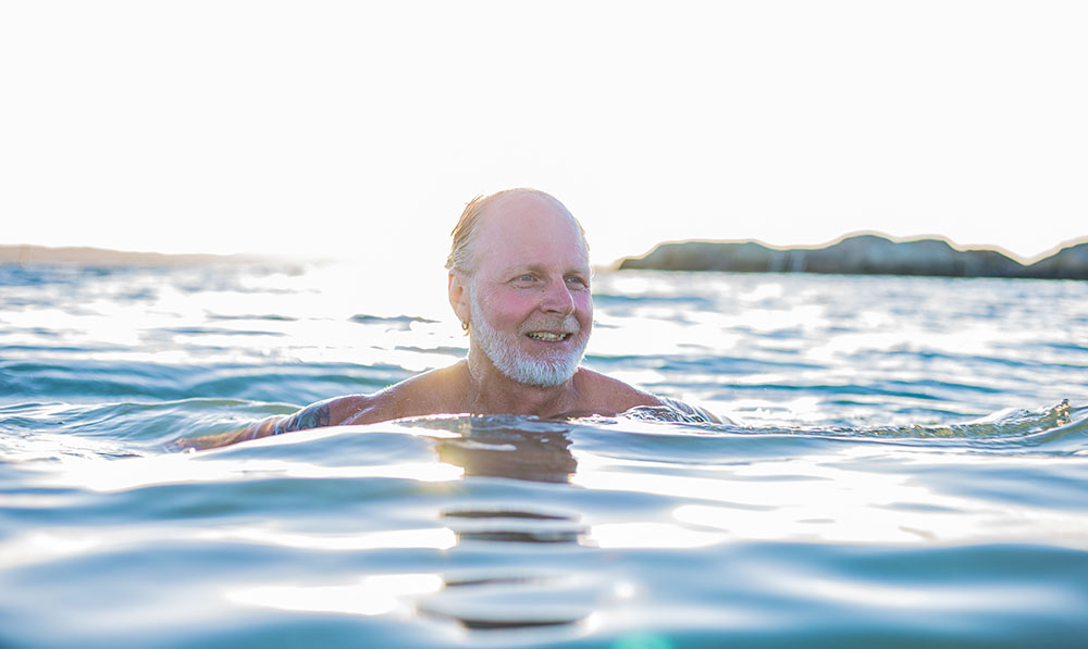 a,very,happy,middle,aged,man,swimming,in,the,ocean,