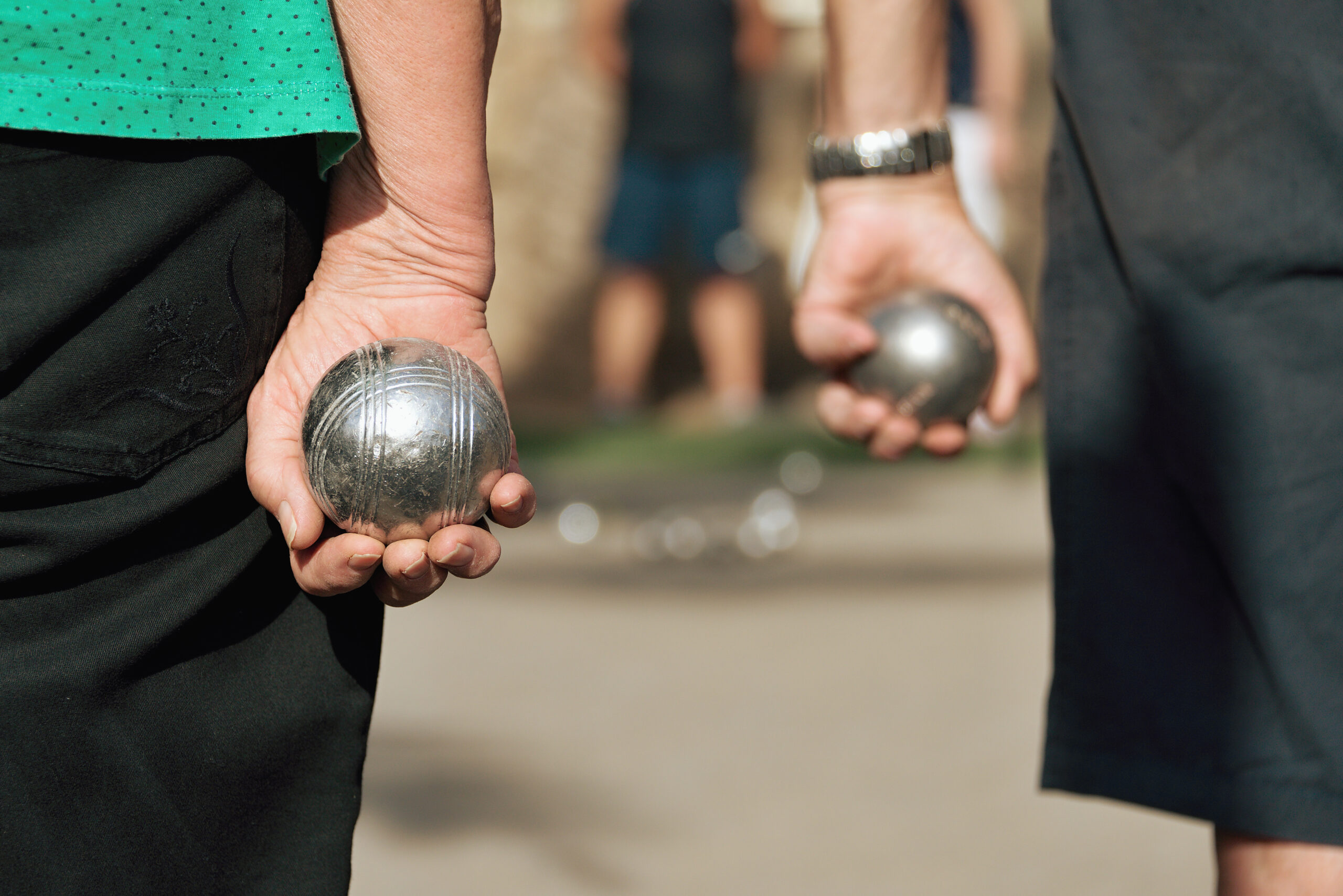close,up,of,people,at,sport,seniors,playing,the,french,game