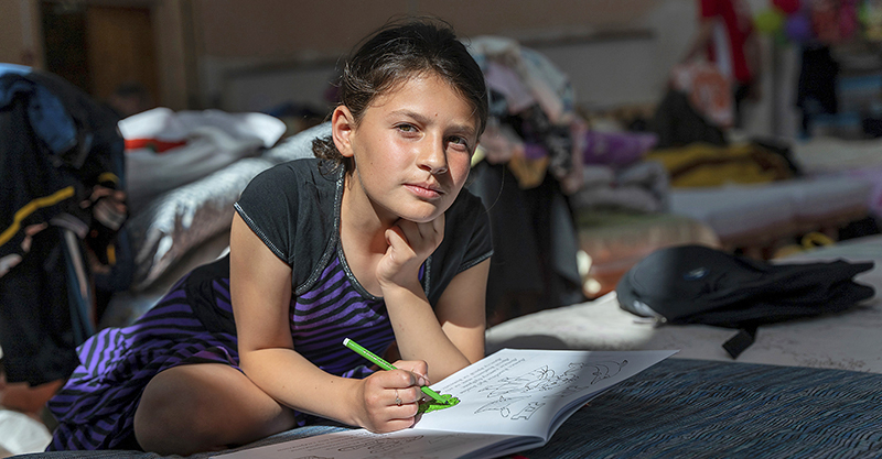 credit paul wuredd barna olesia, 10, drawing on her bed in the