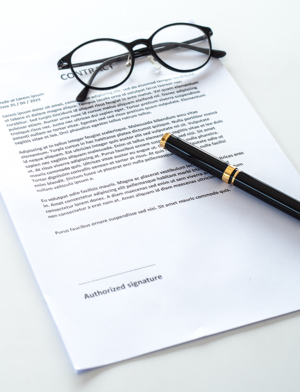 white,table,with,paper,contract,detail,and,empty,space,to