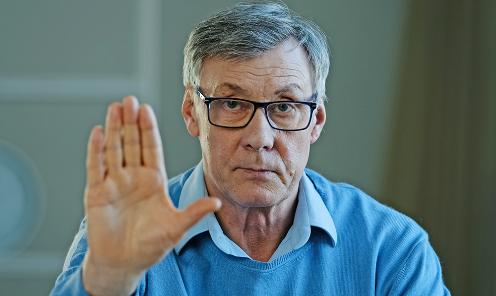 serious,old,senior,mature,60s,man,stretch,out,palm,to