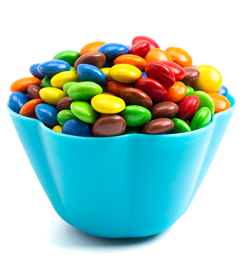 rainbow,colored,candy,coated,chocolate,buttons,in,a,fun,blue