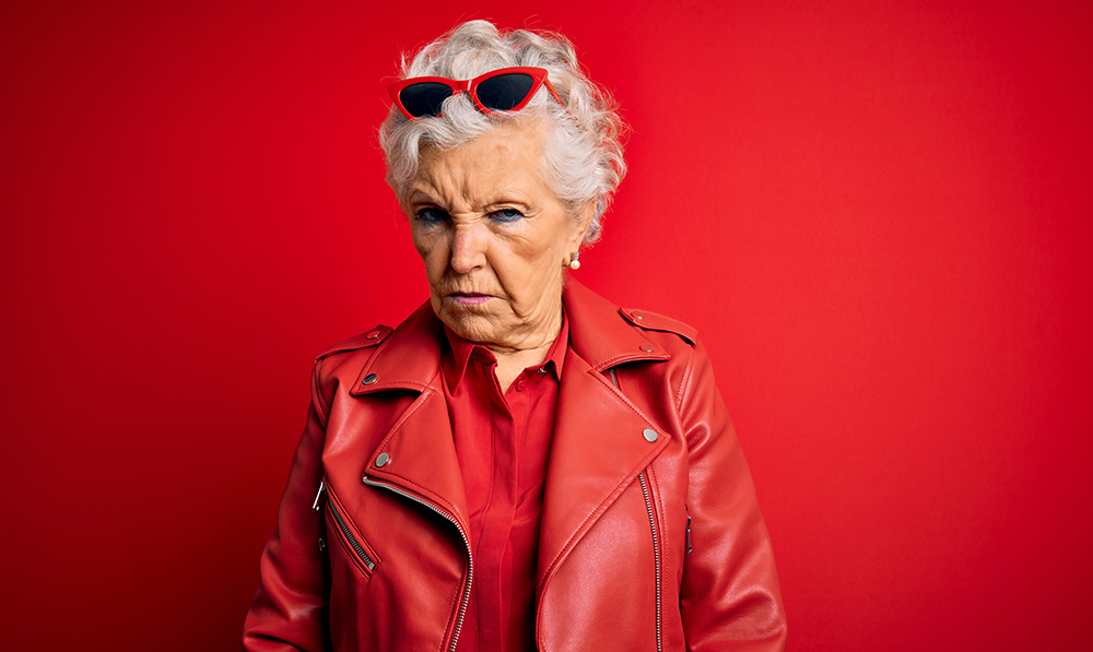senior,beautiful,grey haired,woman,wearing,casual,red,jacket,and,sunglasses
