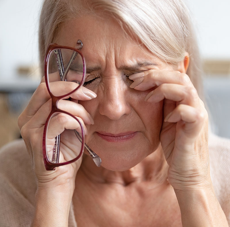 close,up,of,unhealthy,elderly,woman,take,off,glasses,massage