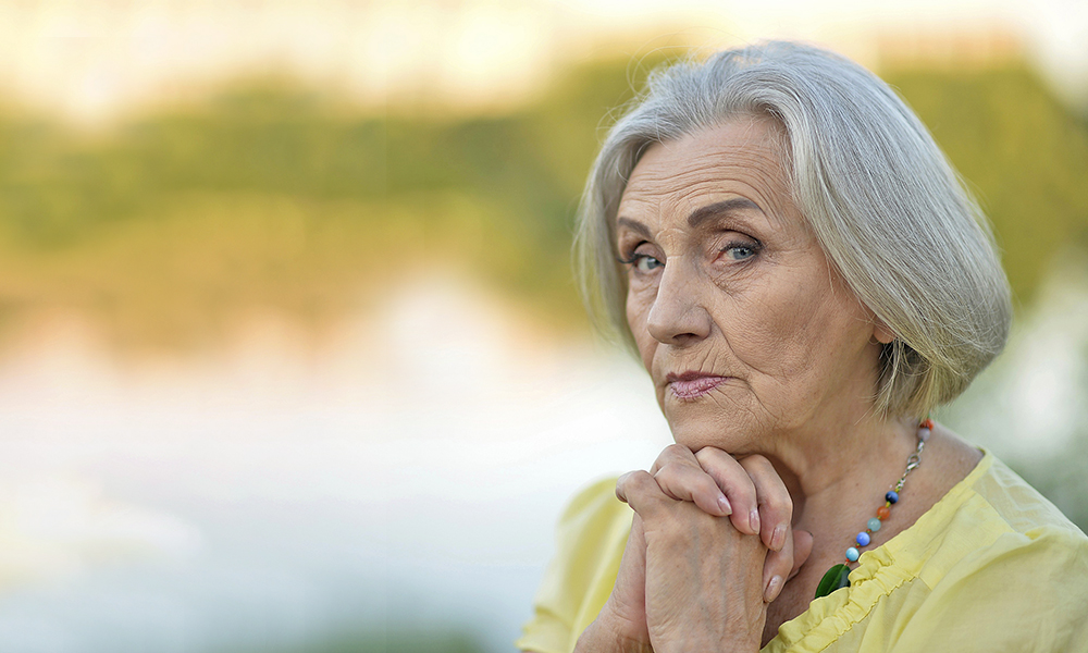 portrait,of,a,beautiful,sad,old,woman,in,the,park