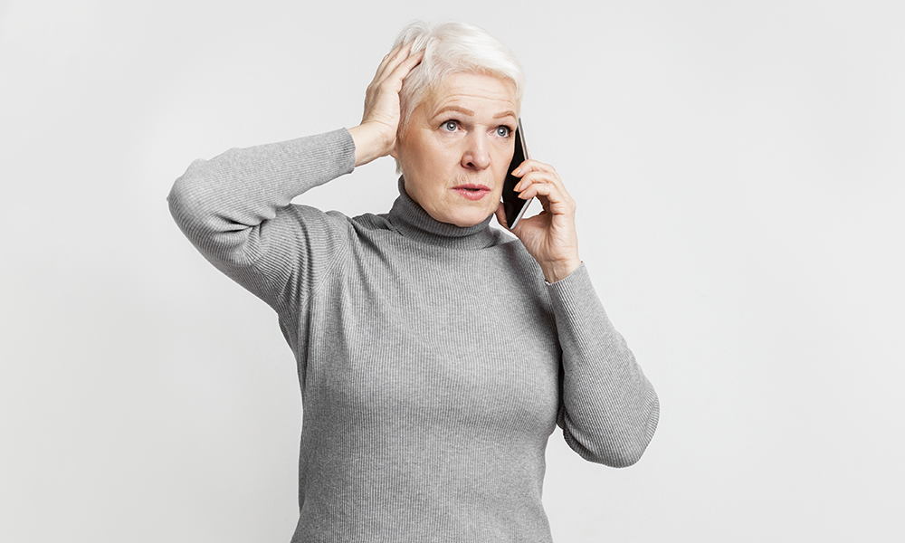 elderly,european,woman,senior,appears,puzzled,during,a,phone,call,