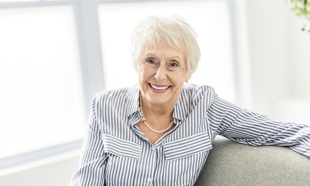 a,smiling,mature,grey,senior,woman,looking,at,camera