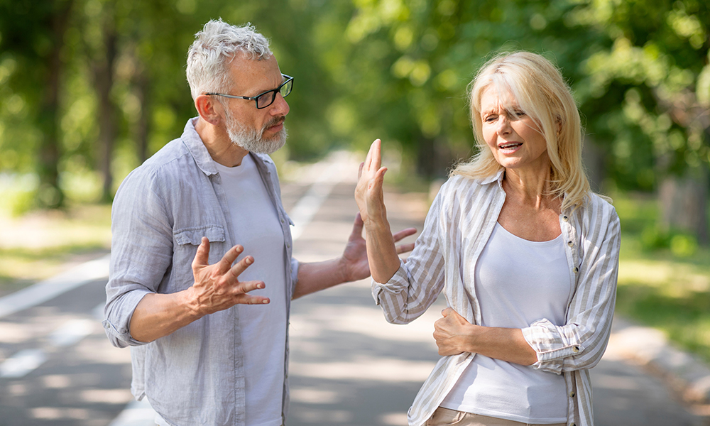 older,couple,conflicts.,mature,spouses,arguing,while,walking,in,park,
