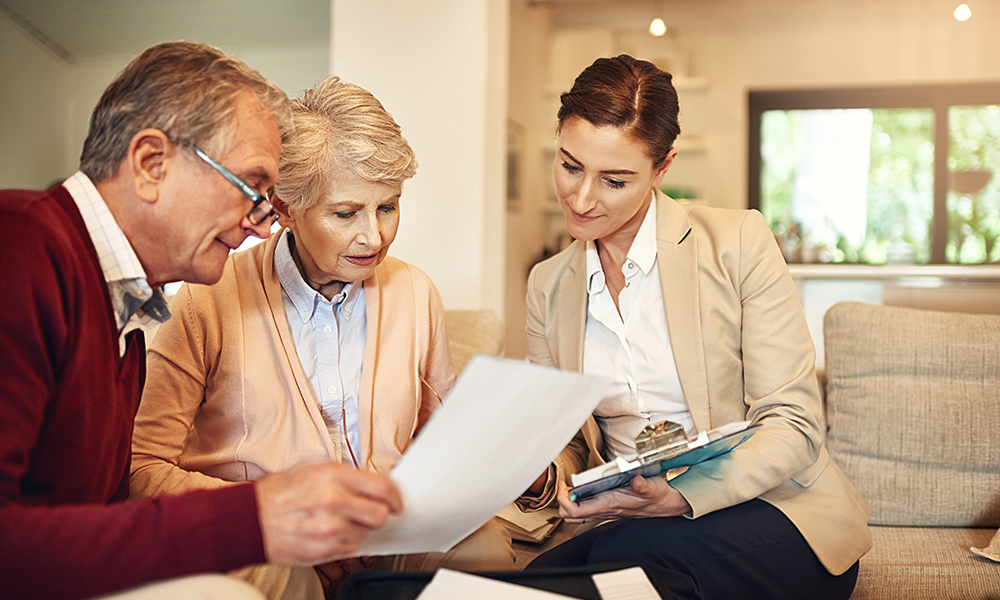 senior,couple,,financial,advisor,and,documents,for,budget,,expense,or