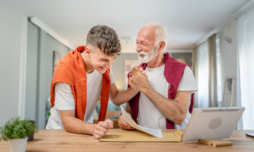 senior,man,grandfather,and,caucasian,man,teenager,boy,grandson,receive