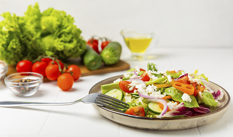 cucumber,salad,on,a,wooden,background.homemade,salad,with,fresh,vegetables,