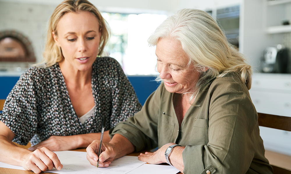 female,friend,helping,senior,woman,to,complete,last,will,and