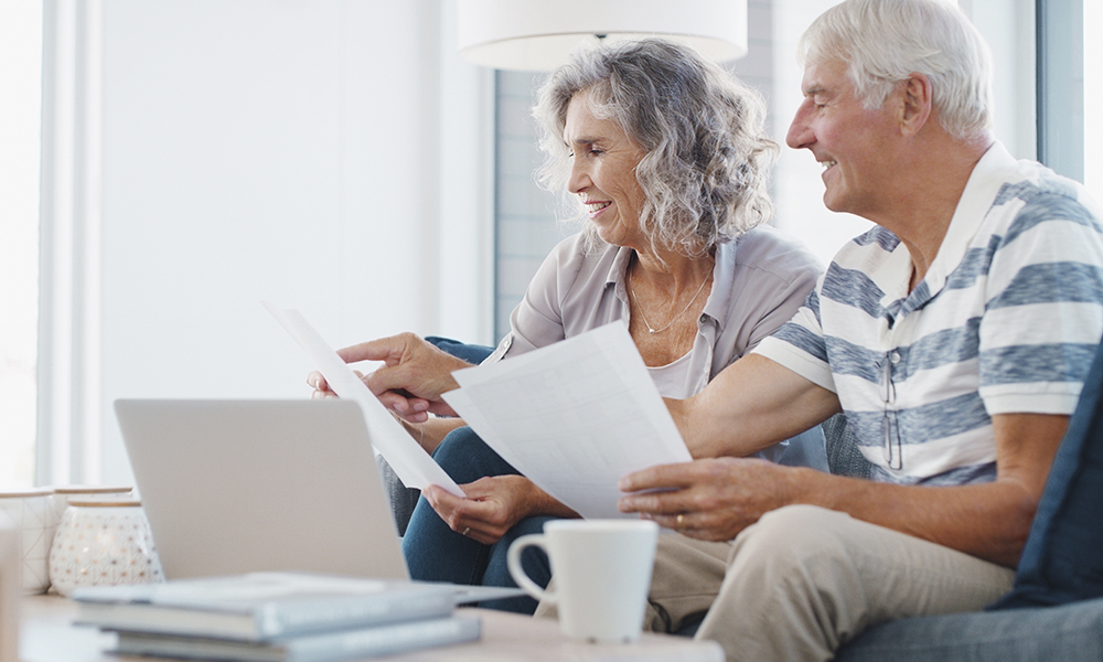 paperwork,,old,couple,and,reading,for,retirement,,laptop,and,financial