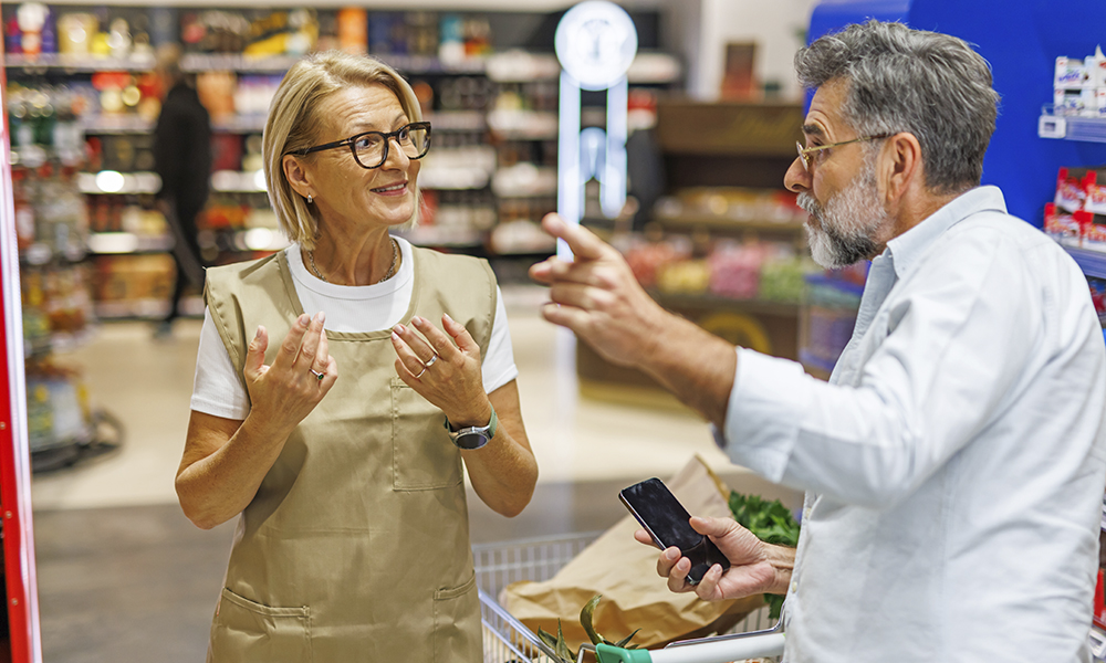 elderly,man,upset,in,supermarket,,arguing,with,employee,over,product