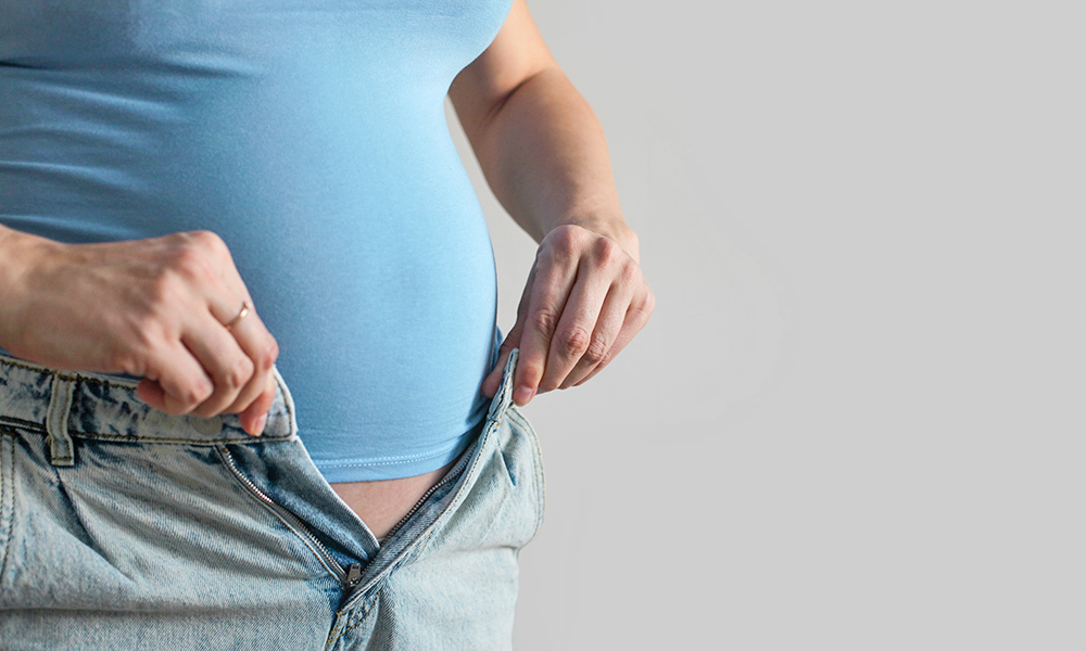 a,fat,woman,with,a,belly,cannot,button,up,her