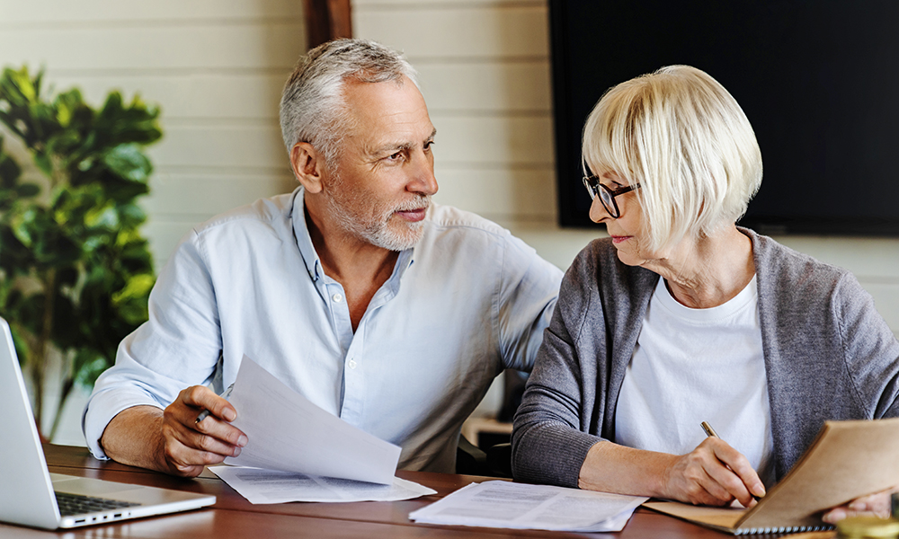 smiling,mature,family,check,utility,bills,for,water,supply,,gas