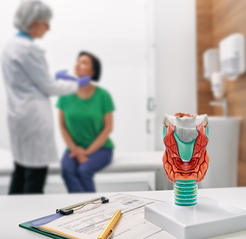 doctor,palpates,of,woman's,neck,for,diagnostics,of,thyroid,diseases.