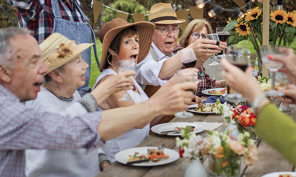 a,group,of,senior,friends,raising,glasses,for,a,toast