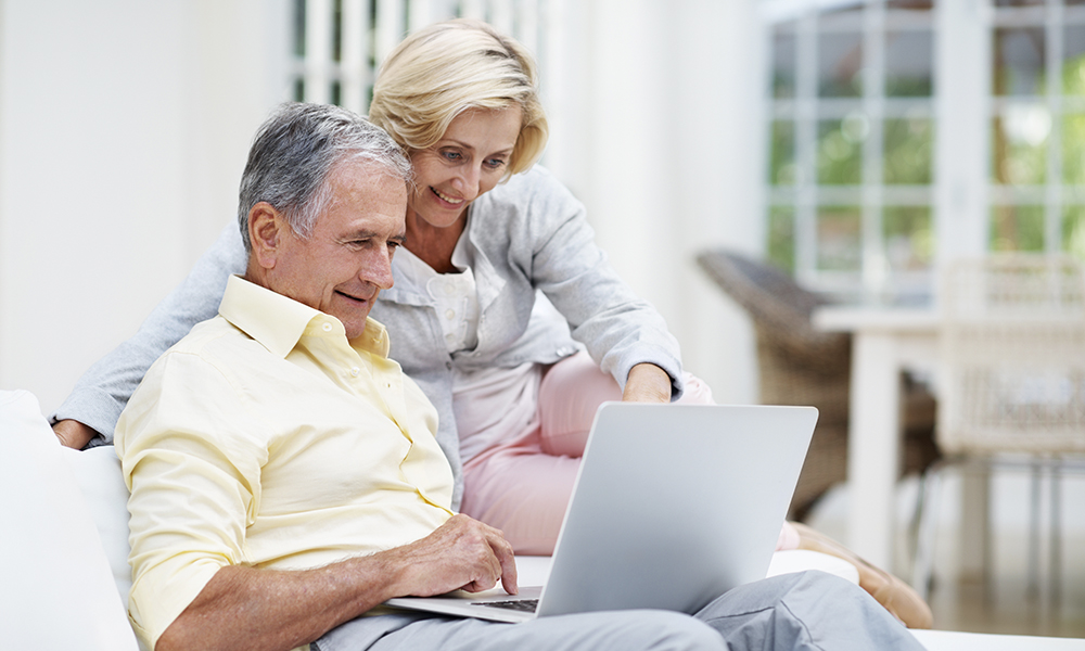 laptop,,relax,and,search,with,old,couple,on,sofa,for